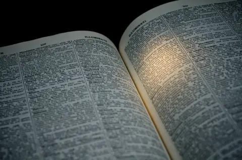 Evidence of an Unseen Hand (or: Being a Dictionary, Opened by Accident and Happenstance, to Page 957, Which Begins with the Entry for 'Illuminati') — dictionary, LED; 24x12x11", 2014 (2 of 2)