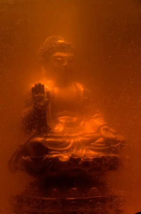 Kool-Aid Buddha [after Serrano] (2008) — work by Lee Henderson