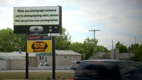 Public Service Announcement ('When you photograph...') (2013) — work by Lee Henderson